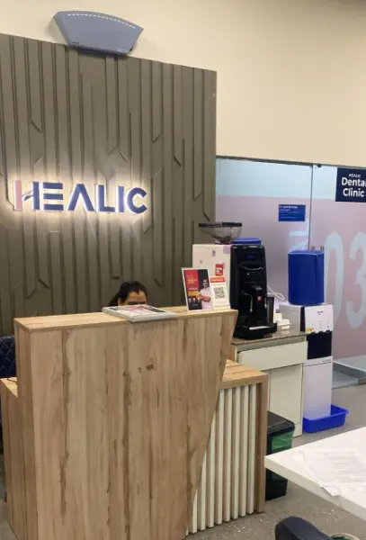 Receptionist Sitting at Reception Desk -  Healic Multispecialty Clinic, Gurgaon